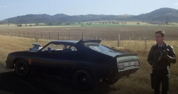 Екшънът от 1979 г. &bdquo;Лудия Макс&ldquo; е съсредоточен върху битките между полиция и бандити, така че естествено колите са в центъра на историята. Филмът се развива и снима в Австралия, където Ford има значително пазарно присъствие. Няколко специално оборудвани Falcon от началото на 70-те са използвани като полицейски прихващачи по време на филма, а Мел Гибсън използва Falcon GT 351 от 73 г. с чудовищен компресор, пронизващ предния капак. В &bdquo;Лудият Макс&ldquo; също участва  цял парк от мотоциклети, включително оборудвана с кош Honda CB750.

Други превозни средства, произведени от Ford, които имат по-малка поява в лентата, включват Lincoln Continental от 1973 г., линейка F-100 от 1977 г. и Ford V8 от 1934 г. Черният Falcon GT е персонализиран за филма от Рей Бекърли от Graf-X International с помощта на дизайнера на автомобилната компания Питър Аркадипане. 

Когато снимките приключват, колата е дадена на механика на снимачната площадка Мъри Смит, който има да взима пари от разорените тогава продуценти на филма. &ldquo;Лудият Макс&ldquo; се превръща в неочакван хит и те я купуват обратно за използване в продължението от 1981 г. Автомобилът  е &bdquo;унищожен&rdquo; в сценария, но продуцентите всъщност изгарят &bdquo;дубльор&ldquo; вместо оригиналния Falcon. След това легендата минава през различни собственици преди да пакрира в Автомобилния музей в Маями през 2012 г. Той е пуснат за продажба през 2020 г. и в момента местонахождението му е пълна мистерия. 